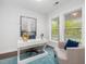 Bright, home office featuring natural light, white walls, and stylish decor at 173 Hawk Point Rd, Chapel Hill, NC 27516