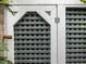 Outdoor storage shed with gray lattice siding and a secure white wooden frame at 173 Hawk Point Rd, Chapel Hill, NC 27516