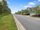 Picturesque street view showcasing well-maintained homes and landscaping within a charming community at 173 Hawk Point Rd, Chapel Hill, NC 27516