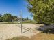 Sand volleyball court with trees and blue skies, perfect for recreational fun in the community at 173 Hawk Point Rd, Chapel Hill, NC 27516