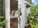 White wooden access doors lead to a view of the yard and under-decking stairs at 173 Hawk Point Rd, Chapel Hill, NC 27516