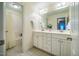 Bathroom with white vanity and sink, large mirror, separate bathtub and shower, and tile flooring at 18 Green Ridge Ln, Pittsboro, NC 27312