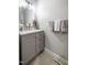 Stylish half bathroom with a marble vanity top, modern lighting, and neutral wall colors at 18 Green Ridge Ln, Pittsboro, NC 27312