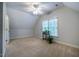 Bright bedroom with neutral carpet and ceiling fan creates a clean, relaxing space at 18 Green Ridge Ln, Pittsboro, NC 27312