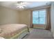 Neutral bedroom featuring large bed with decorative quilt, neutral walls and carpet and bright natural light at 18 Green Ridge Ln, Pittsboro, NC 27312