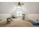 Finished bonus room featuring neutral walls and carpet, a ceiling fan and a workout area with equipment at 18 Green Ridge Ln, Pittsboro, NC 27312