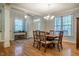 Elegant dining room featuring hardwood floors, neutral walls, and natural light from several windows at 18 Green Ridge Ln, Pittsboro, NC 27312