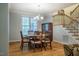 Charming dining room with hardwood floors, chandelier, and staircase access nearby at 18 Green Ridge Ln, Pittsboro, NC 27312