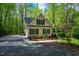 Attractive two-story home with green shutters and a well-manicured front yard at 18 Green Ridge Ln, Pittsboro, NC 27312