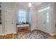 Bright foyer with hardwood floors, a decorative rug, and a transom window above the front door at 18 Green Ridge Ln, Pittsboro, NC 27312
