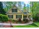 Charming home featuring a manicured front lawn, stone walkway, and inviting front porch perfect for a Gathering at 18 Green Ridge Ln, Pittsboro, NC 27312