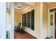 Inviting front porch with rocking chairs and a window with dark green shutters at 18 Green Ridge Ln, Pittsboro, NC 27312
