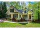 Charming home with manicured lawn and a welcoming front porch at 18 Green Ridge Ln, Pittsboro, NC 27312