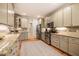 Well-equipped kitchen with stainless appliances, granite countertops, and updated cabinets at 18 Green Ridge Ln, Pittsboro, NC 27312