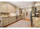Charming kitchen featuring stainless appliances, granite counters, and custom cabinetry at 18 Green Ridge Ln, Pittsboro, NC 27312
