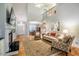 Open-concept living room with hardwood floors, fireplace, and tall vaulted ceilings at 18 Green Ridge Ln, Pittsboro, NC 27312