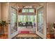 Sun-drenched room with floor to ceiling windows offering serene nature views of the surrounding forest at 18 Green Ridge Ln, Pittsboro, NC 27312