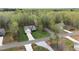 Aerial view of the home showing a well-manicured lawn and a wooded backdrop at 20 Izuba Day Dr, Timberlake, NC 27583