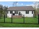 Well-maintained fenced backyard with a deck, grill, and lush green lawn at 20 Izuba Day Dr, Timberlake, NC 27583