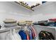 Walk-in closet with an assortment of clothing and shoe storage solutions at 20 Izuba Day Dr, Timberlake, NC 27583
