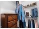 Walk-in closet with hanging clothes, shelves, and a dresser at 20 Izuba Day Dr, Timberlake, NC 27583