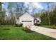 Charming two-story home with a large front lawn, landscaping, and a two car garage at 20 Izuba Day Dr, Timberlake, NC 27583