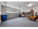 Spacious two car garage with plenty of storage, shelving, and an open garage door at 20 Izuba Day Dr, Timberlake, NC 27583