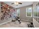 Bright gym with natural light, workout bench, free weights, and an accent wall at 20 Izuba Day Dr, Timberlake, NC 27583