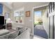 Bright living room featuring a large window and access to the outdoors with a comfortable seating area at 20 Izuba Day Dr, Timberlake, NC 27583