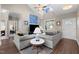 Bright living room featuring vaulted ceilings, hardwood floors and comfortable seating area at 20 Izuba Day Dr, Timberlake, NC 27583