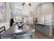 Open concept living and dining area with vaulted ceilings and updated kitchen with stainless steel appliances at 20 Izuba Day Dr, Timberlake, NC 27583
