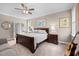 Bedroom featuring a ceiling fan, a wooden framed bed, carpet flooring and natural light at 20 Izuba Day Dr, Timberlake, NC 27583