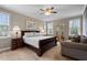 Bedroom featuring a ceiling fan, a wooden framed bed, carpet flooring and natural light at 20 Izuba Day Dr, Timberlake, NC 27583