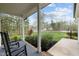 Inviting front porch with rocking chairs and views of the surrounding landscape at 20 Izuba Day Dr, Timberlake, NC 27583