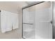 Shower featuring a glass door, a built-in seat, and modern fixtures at 20 Izuba Day Dr, Timberlake, NC 27583