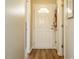 Bright hallway featuring updated flooring and a classic front door with decorative window at 202 Providence Hall Dr, Sanford, NC 27330