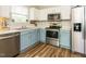 Modern kitchen features stainless steel appliances, updated cabinets, and bright natural light at 202 Providence Hall Dr, Sanford, NC 27330