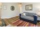 Comfortable living room features neutral walls, wood floors, and a cozy seating area at 202 Providence Hall Dr, Sanford, NC 27330