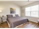 Cozy main bedroom with hardwood floors, a double bed, and a window at 202 Providence Hall Dr, Sanford, NC 27330