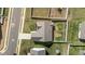 Aerial perspective of a single-Gathering home showcasing the roof, lawn, and driveway at 205 Mcclellan Trl, Mebane, NC 27302