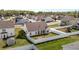 Aerial perspective showcases the home's backyard, complete with a private fence and covered patio for outdoor enjoyment at 205 Mcclellan Trl, Mebane, NC 27302