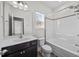 This bathroom has a large mirror and shower over the bath at 205 Mcclellan Trl, Mebane, NC 27302