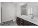 Bathroom with dual sinks, a large mirror, and a tile floor at 205 Mcclellan Trl, Mebane, NC 27302