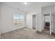 This carpeted bedroom has a closet and doorway leading into a bathroom at 205 Mcclellan Trl, Mebane, NC 27302