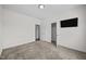 Comfortable carpeted bedroom featuring a television and closet for ample storage at 205 Mcclellan Trl, Mebane, NC 27302