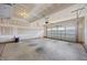 Spacious unfinished garage with concrete floor and garage door at 205 Mcclellan Trl, Mebane, NC 27302
