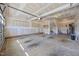 Unfinished garage interior with concrete floor and modern door at 205 Mcclellan Trl, Mebane, NC 27302