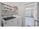 Laundry room features new, modern washer and dryer with garage entrance at 205 Mcclellan Trl, Mebane, NC 27302