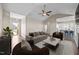 Open-concept living room featuring vaulted ceilings, a ceiling fan, and seamless flow into the kitchen at 205 Mcclellan Trl, Mebane, NC 27302