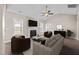 Cozy living room with a fireplace, ceiling fan, plenty of natural light, and comfortable seating at 205 Mcclellan Trl, Mebane, NC 27302